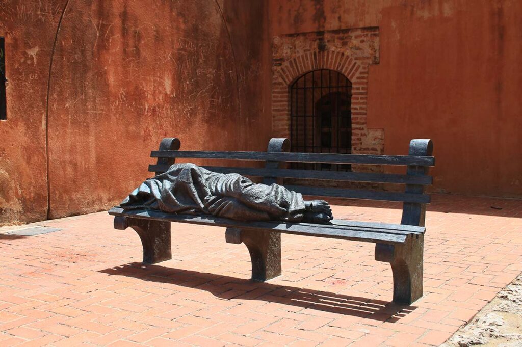 statue of Jesus on a bench in the Dominican Republic